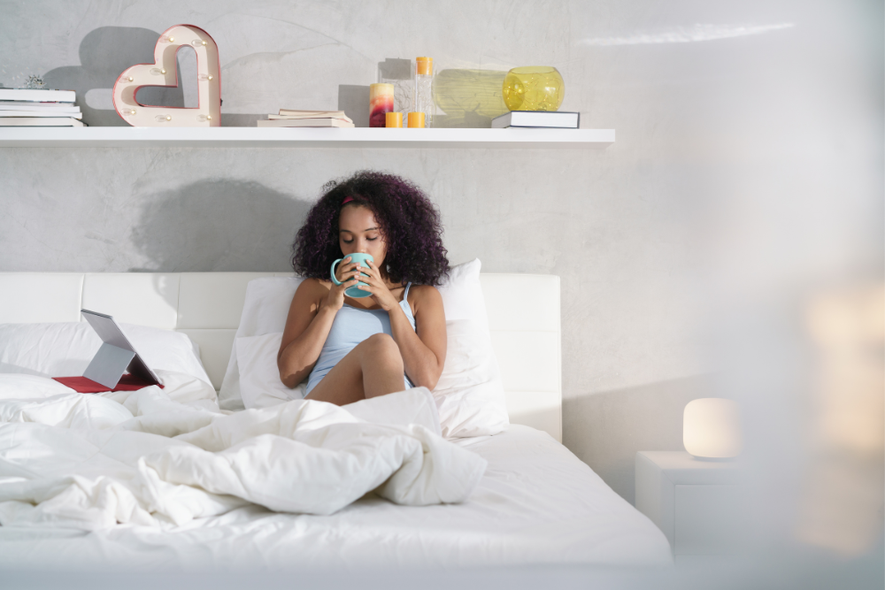 woman reading digital ebook in bed